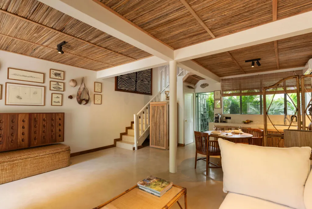 Deluxe Family Suite living area, with TV and full-size fridge discreetly concealed in wood